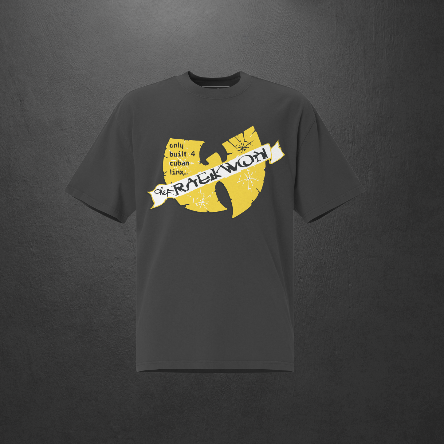 Black t-shirt with yellow graphic design on a dark gray background